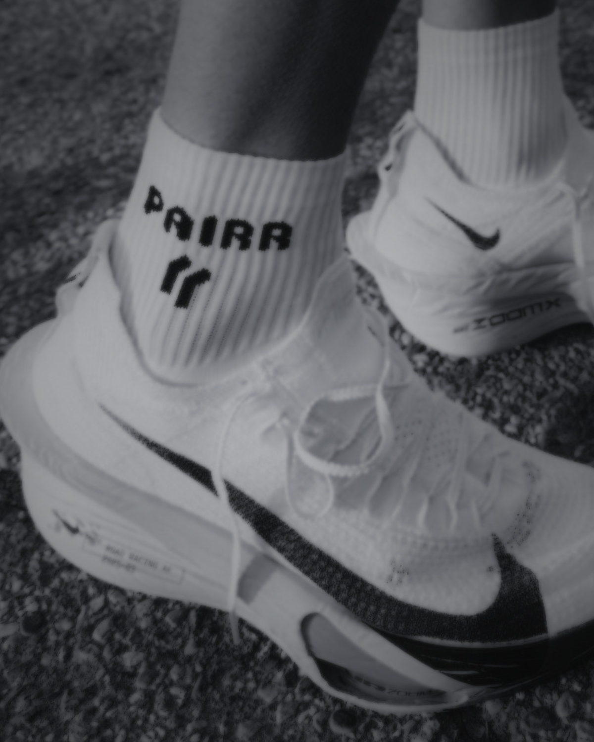 Lifestyle of Nike Alphaflys with quarter-length PAIRR White OG performance Running Socks