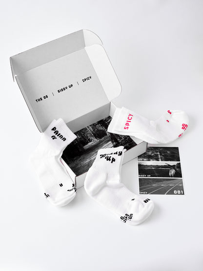 Performance running socks in white quarter box collection PAIRR with GIDDY UP, PAIRR OG, and SPICY