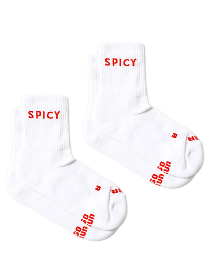 Two white running socks with red 'SPICY' branding printed on the cuffs and toes, displayed on a clean white background.