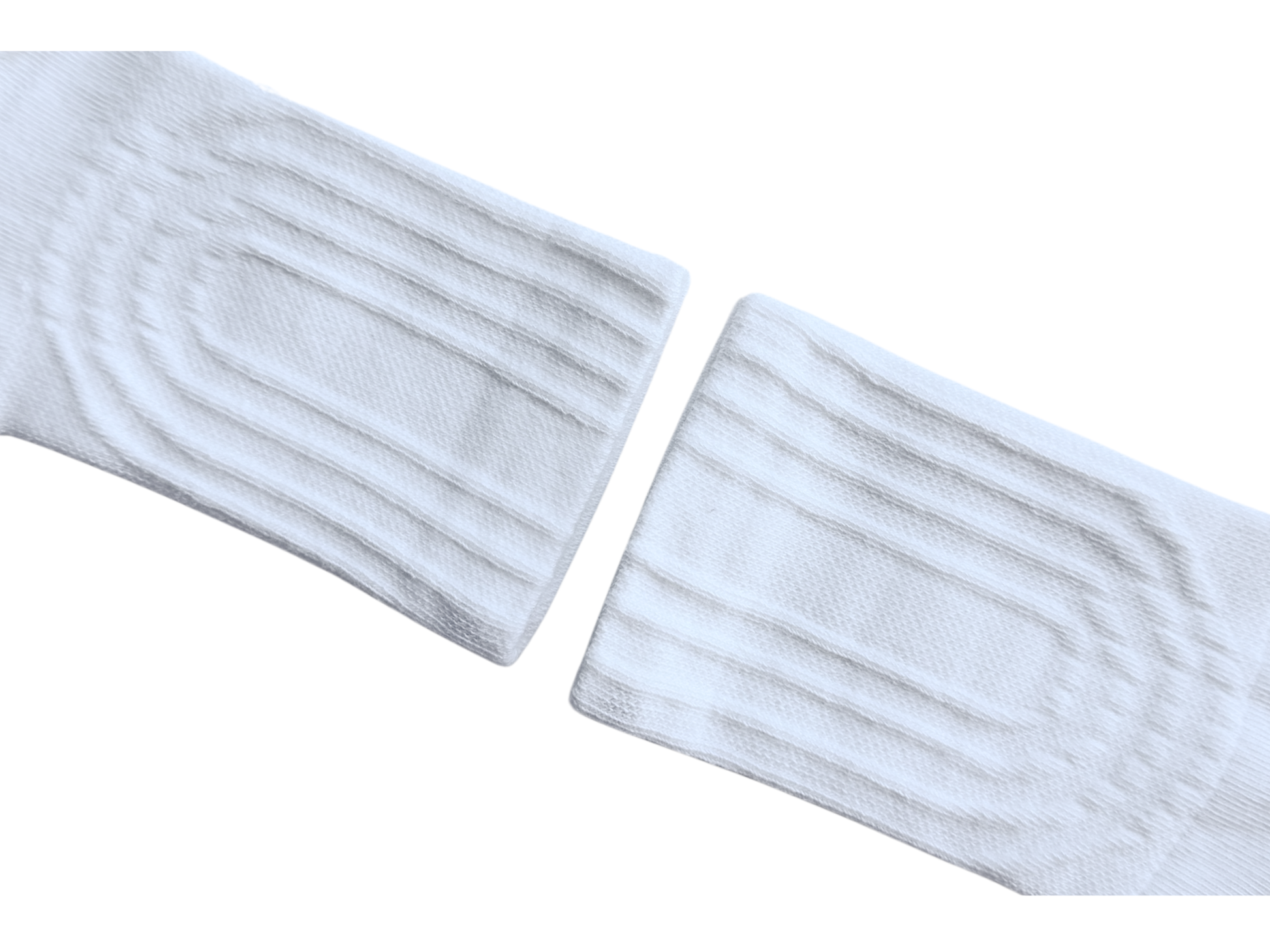 Two white socks with ribbed texture on a white background 