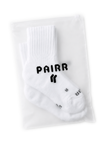 PAIRR Performance running socks in Style 400 contained within the retail bag.